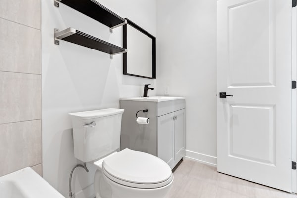 Clean modern bathroom with toilet installation